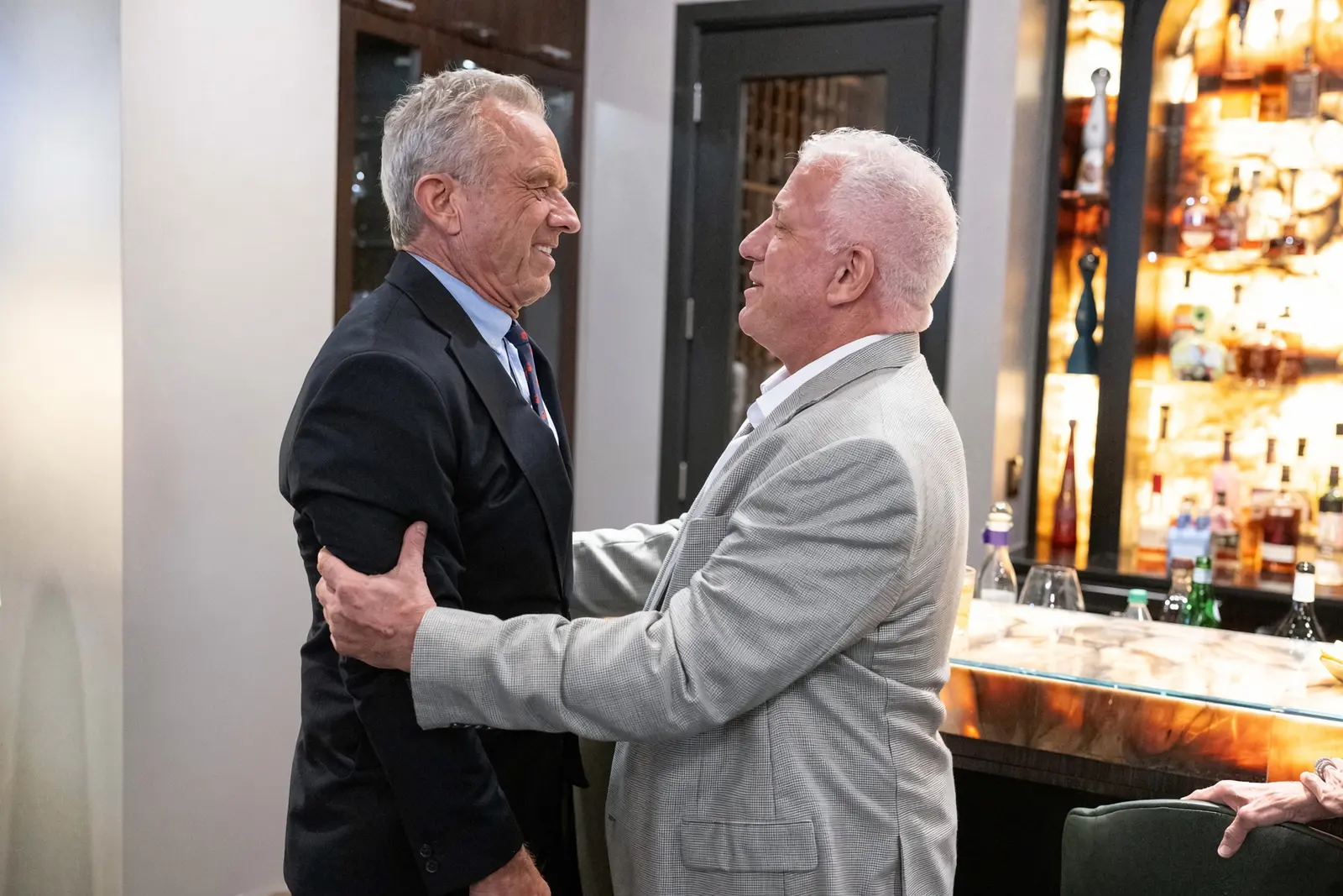 Robert F. Kennedy Jr. and Dr. Gary Kompothecras greet each other warmly